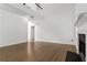 Minimalist living room with a fireplace and hardwood floors viewed from a slight angle at 1620 Concord Meadows Dr, Smyrna, GA 30082