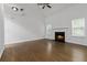 Spacious living room with fireplace, high ceilings, and natural light from large windows at 1620 Concord Meadows Dr, Smyrna, GA 30082
