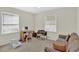 This bedroom has multiple desks and a sofa which can double as an office space at 5868 Ash St, Forest Park, GA 30297