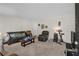 Comfortable living room with plush seating, carpet, and neutral walls at 5868 Ash St, Forest Park, GA 30297