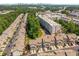 An aerial view of a townhome community offering a blend of comfort, style, and neighborhood charm in a green surrounding at 2015 Liberty Nw Ct, Atlanta, GA 30318