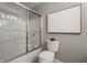 Bathroom showcasing a tiled shower with glass doors and modern fixtures and decor at 2015 Liberty Nw Ct, Atlanta, GA 30318