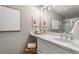 This bright bathroom features a marble countertop, modern vanity and a glass shower at 2015 Liberty Nw Ct, Atlanta, GA 30318