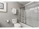 Clean bathroom with toilet, glass shower door, and neutral color scheme at 2015 Liberty Nw Ct, Atlanta, GA 30318