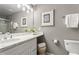 Well-lit bathroom with double vanity, quartz countertop, and framed mirror at 2015 Liberty Nw Ct, Atlanta, GA 30318