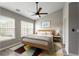 Bright bedroom features a modern ceiling fan, a large window and stylish decor at 2015 Liberty Nw Ct, Atlanta, GA 30318