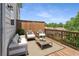 Relaxing deck with outdoor furniture, wood railing, and trees in the background at 2015 Liberty Nw Ct, Atlanta, GA 30318