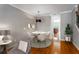 Dining area with modern lighting, decor, and seamless flow into the kitchen and living spaces at 2015 Liberty Nw Ct, Atlanta, GA 30318