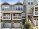 Charming townhome with double garage, covered balconies, and traditional design at 2015 Liberty Nw Ct, Atlanta, GA 30318