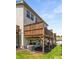 View of the back of the home showcasing the wooden deck and manicured lawn on a bright, sunny day at 2015 Liberty Nw Ct, Atlanta, GA 30318
