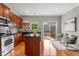 Spacious kitchen with an island, stainless steel appliances, and access to a private balcony at 2015 Liberty Nw Ct, Atlanta, GA 30318