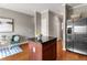 Stylish kitchen island with dark cabinets, granite countertop, and hardwood floors at 2015 Liberty Nw Ct, Atlanta, GA 30318
