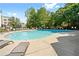 Large swimming pool surrounded by lounge chairs and lush greenery, perfect for relaxation and recreation at 2015 Liberty Nw Ct, Atlanta, GA 30318