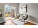 Comfortable sitting area with two chairs next to a sliding glass door leading to a deck at 2015 Liberty Nw Ct, Atlanta, GA 30318