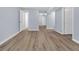 Spacious basement area with light blue walls and wood-look vinyl flooring at 2496 Shiloh Dr, Decatur, GA 30034