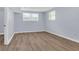 Finished bedroom in basement with wood-look flooring, neutral paint and window at 2496 Shiloh Dr, Decatur, GA 30034