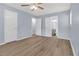 Spacious bedroom featuring hardwood floors, a ceiling fan, and a connected bathroom at 2496 Shiloh Dr, Decatur, GA 30034