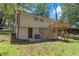 Exterior view of the home featuring a deck with stairs at 2496 Shiloh Dr, Decatur, GA 30034