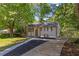 Charming home featuring a well maintained front yard, black roof, and brown trim at 2496 Shiloh Dr, Decatur, GA 30034