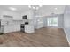 Modern kitchen with white cabinets and stainless steel appliances, open to the living area at 2496 Shiloh Dr, Decatur, GA 30034
