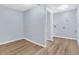 Laundry room with light blue walls, white trim and wood-look vinyl flooring at 2496 Shiloh Dr, Decatur, GA 30034