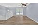 Open-concept living area with sleek flooring and natural light, providing a spacious and airy ambiance at 2496 Shiloh Dr, Decatur, GA 30034