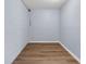 Room with light blue walls, white trim and wood-look vinyl flooring at 2496 Shiloh Dr, Decatur, GA 30034