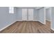 Room with light blue walls, white trim and wood-look vinyl flooring at 2496 Shiloh Dr, Decatur, GA 30034