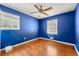 Cozy bedroom features hardwood floors, a ceiling fan and lots of natural light at 4361 Kimball Rd, Atlanta, GA 30331