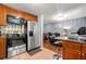 A well-equipped kitchen that includes stainless steel appliances and stylish breakfast bar seating at 4361 Kimball Rd, Atlanta, GA 30331