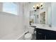 Clean bathroom with white tiled walls, a combined tub and shower, and a vanity with storage at 746 N Highland Ne Ave # 7, Atlanta, GA 30306