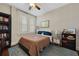 Comfortable bedroom featuring a large window, neutral color scheme, and built-in bookshelf at 746 N Highland Ne Ave # 7, Atlanta, GA 30306