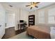 Bedroom with a desk and bookshelf, featuring a neutral color scheme, and hardwood floors at 746 N Highland Ne Ave # 7, Atlanta, GA 30306