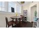 Cozy kitchen breakfast nook with bright windows, hardwood floors, and wooden dining table at 746 N Highland Ne Ave # 7, Atlanta, GA 30306