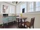 Cozy kitchen breakfast nook with bright windows, hardwood floors, and wooden dining table at 746 N Highland Ne Ave # 7, Atlanta, GA 30306