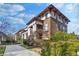 Stunning exterior featuring stately columns, classic architecture, and lush landscaping under a partly cloudy sky at 746 N Highland Ne Ave # 7, Atlanta, GA 30306