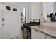 Kitchen features granite countertops, white cabinets and modern black oven at 746 N Highland Ne Ave # 7, Atlanta, GA 30306