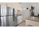Galley style kitchen featuring granite countertops, stainless steel appliances, and white cabinetry at 746 N Highland Ne Ave # 7, Atlanta, GA 30306
