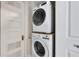Convenient laundry area featuring stacked washer and dryer units behind white doors at 746 N Highland Ne Ave # 7, Atlanta, GA 30306