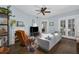 Comfortable living room featuring a fireplace, ceiling fan, and hardwood floors at 746 N Highland Ne Ave # 7, Atlanta, GA 30306