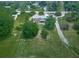 Expansive aerial view of the property with lush green lawn and mature trees surrounding the house at 104 Cochran Ridge Rd, Dallas, GA 30157