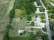 Aerial view of a property featuring a home, outbuilding, and large lot at 104 Cochran Ridge Rd, Dallas, GA 30157