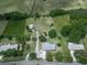 Aerial view of the property with a long driveway, detached garage and a well-maintained lawn at 104 Cochran Ridge Rd, Dallas, GA 30157