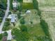 Aerial view of a home on a large lot with a detached garage, showcasing ample space and privacy at 104 Cochran Ridge Rd, Dallas, GA 30157