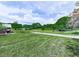 Expansive backyard with lush green grass and mature trees, perfect for outdoor activities at 104 Cochran Ridge Rd, Dallas, GA 30157