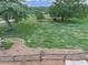Picturesque backyard featuring a wooden fence, mature trees, and expansive green space at 104 Cochran Ridge Rd, Dallas, GA 30157