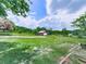 Spacious backyard with lush green grass and a red storage shed at 104 Cochran Ridge Rd, Dallas, GA 30157