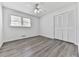 Bedroom featuring a ceiling fan, new floors, and a window at 104 Cochran Ridge Rd, Dallas, GA 30157