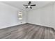 Bright bedroom with a ceiling fan, and hardwood floors at 104 Cochran Ridge Rd, Dallas, GA 30157