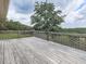 Spacious wooden deck offering a serene outdoor space with views of the surrounding greenery at 104 Cochran Ridge Rd, Dallas, GA 30157